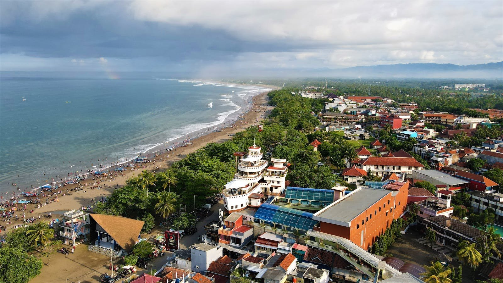 Stunning aerial view of Pangandaran Beach in Java, Indonesia, showcasing the coastline and vibrant cityscape.